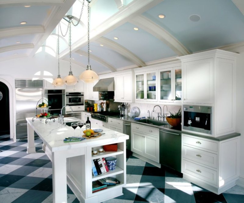 carrera-marmor-bordplader-in-køkken-traditionel-med-buede loft-indbygget-bogreol-2